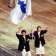 North Korea’s judo coach and a South Korean basketball player carry the unified Korean flag during the opening ceremony of the Olympics in Sydney, Australia.